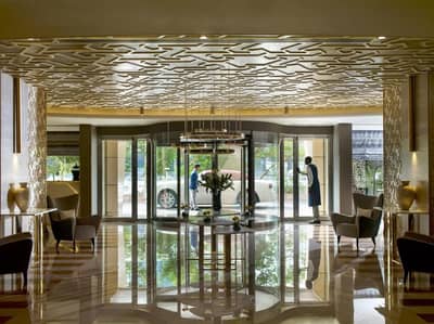 Spacious and elegant lobby area of Two Seasons Hotel & Apartments Dubai with modern furnishings.