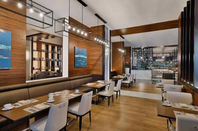 Elegant dining area at Hilton Dubai Palm Jumeirah, modern decor.