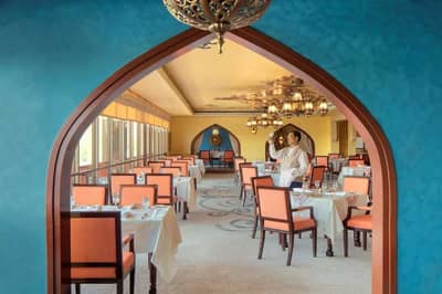 Vibrant dining room with arches, Radisson Blu Hotel, Dubai Deira Creek.