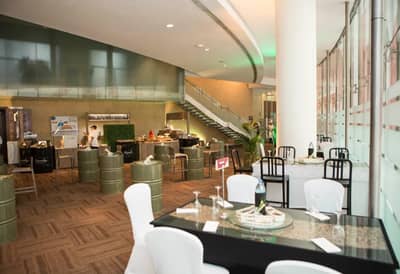 Dubai World Trade Centre event space with tables and staircase.