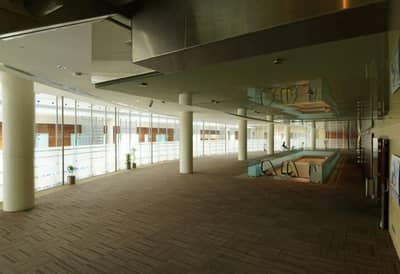 Spacious interior of Dubai World Trade Centre with glass walls.