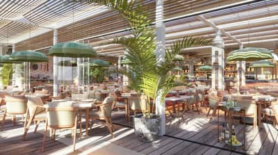 Maison de La Plage Dubai, elegant dining area with green umbrellas.