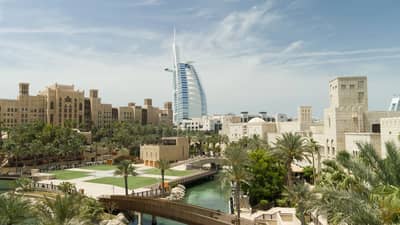 Madinat Jumeirah resort with Burj Al Arab, Dubai skyline view.