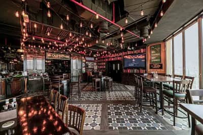 McCafferty's Pub interior, patterned floor tiles, pendant lights, Dubai.