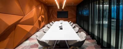 Modern meeting room at D3 Dubai Design District with geometric walls.