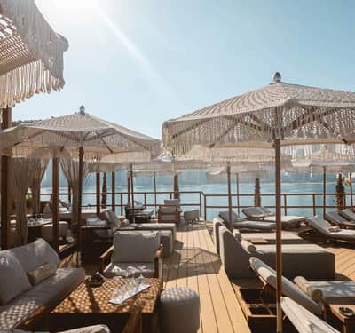 Luxurious cabanas and loungers at Be Beach DXB, Dubai waterfront.