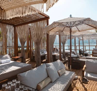 Luxurious cabanas at Be Beach DXB overlooking Dubai waterfront.