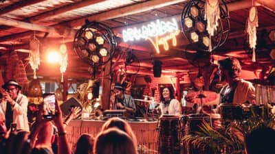 Live band performing at Surf Club Dubai with vibrant lighting.