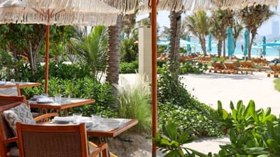 Outdoor dining at Surf Club Dubai with beach view.