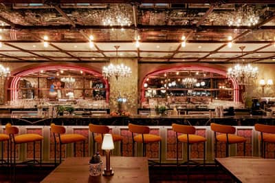 Elegant bar interior at Papas Dubai Marina with chandeliers.