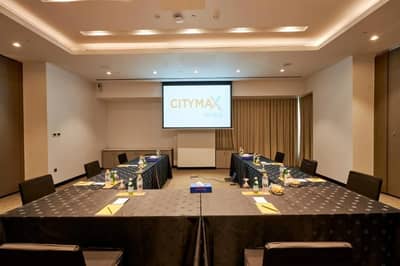 Conference room at Citymax Hotel Business Bay, Dubai, with presentation setup.