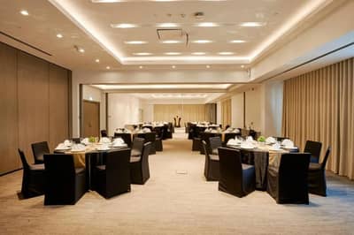 Spacious banquet room with round tables, Citymax Hotel Business Bay, Dubai.