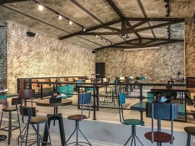 Industrial-style dining area, Citymax Hotel Business Bay, Dubai.