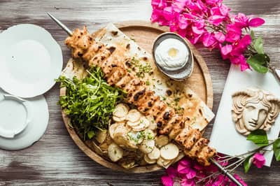 Grilled skewers with greens at Opa Dubai restaurant.