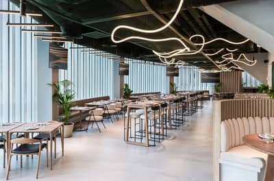 Modern interior of Bedrock Pier 7 restaurant in Dubai with stylish lighting.