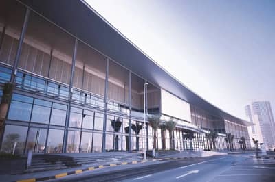 Modern exterior of Expo Centre Sharjah with glass facade.