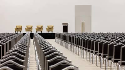 Grand Hyatt Dubai theatre setup with podium and chairs