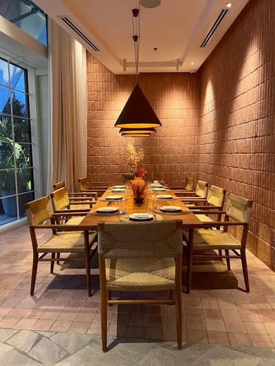 Elegant dining setup at Mythos Urban Greek Eatery, Dubai.