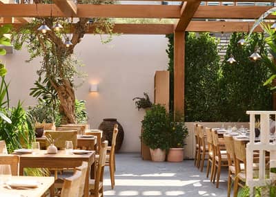 Sunny patio dining at Mythos Urban Greek Eatery, Dubai.