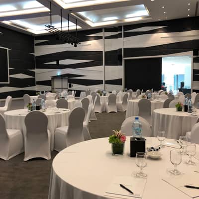 Almas Conference Centre Dubai, elegant round tables set for event.