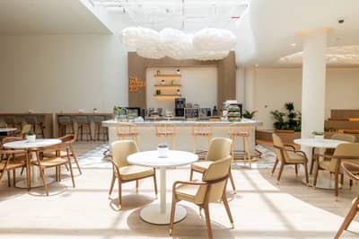 Modern cafe interior at Cloud Spaces Circle Mall Dubai.