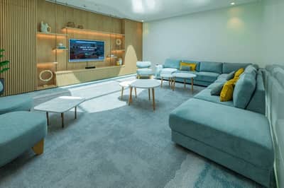 Stylish lounge with blue sofas, Cloud Spaces Circle Mall Dubai.