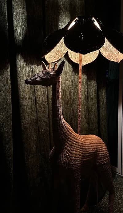 Giraffe-shaped lamp in Flamingo Room by tashas, Abu Dhabi.