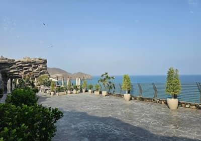 Terrace view at Habib Beirut Restaurant Khorfakkan, overlooking the sea.