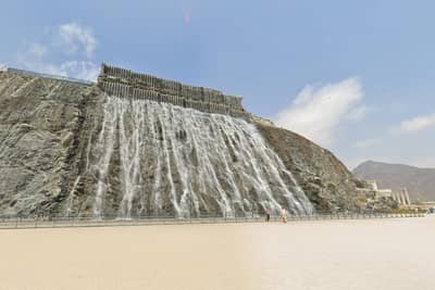 Khorfakkan waterfall near Habib Beirut Restaurant, Sharjah, under clear sky.