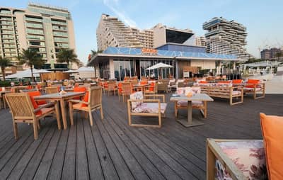 Outdoor seating at Orange Chameleon Restaurant & Lounge, Dubai.