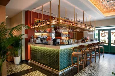 Stylish bar interior at Grand Zor Restaurant, Dubai with decorative tiles.