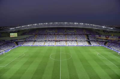 Empty Hazza Bin Zayed Stadium in Al Ain at dusk.