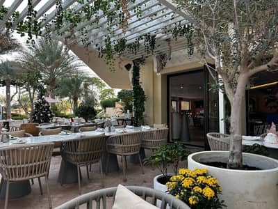 Outdoor dining area at Peaches & Cream Beach Restaurant, Dubai.