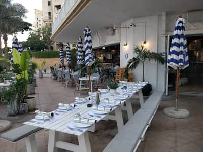 Outdoor seating at The Byron Bathers Beach Club & Bar, Dubai.