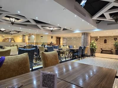 Spacious dining area at Al Bait Al Shami Restaurant, Dubai.