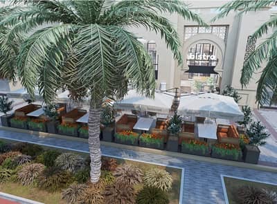 Outdoor seating at Bakerist The Palm Jumeirah, Dubai with palm trees.