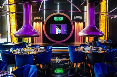 KUKU Restaurant Dubai with vibrant decor and plush seating.