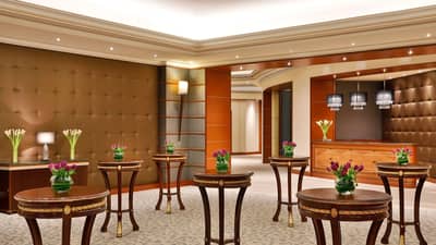 Elegant lobby with floral arrangements, The Ritz Carlton Riyadh.