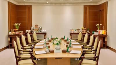 Elegant meeting room at The Ritz Carlton Riyadh, set for conference.