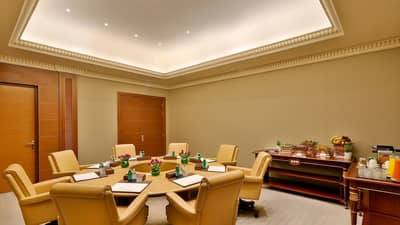Elegant meeting room at The Ritz Carlton Riyadh with refreshments.