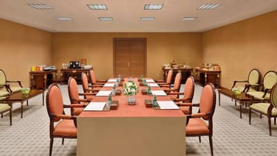 Elegant conference room at The Ritz Carlton Riyadh, set for meeting.