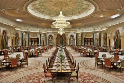 Elegant ballroom at The Ritz Carlton Riyadh with chandeliers.