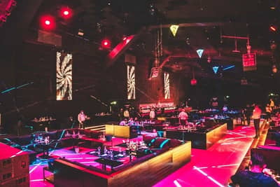 Colorful interior of Vice Night Club Downtown Dubai with seating.