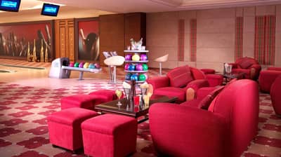 Luxurious bowling lounge at The Ritz Carlton Riyadh, vibrant seating area.