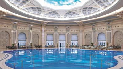Ornate indoor pool with domed ceiling, The Ritz Carlton Riyadh.