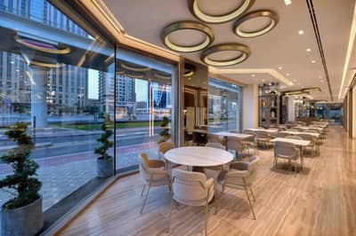Modern interior of Al Safadi Restaurant DIFC, Dubai with large windows.