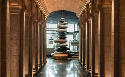 Elegant stone hallway with sculpture, Babel Dubai Restaurant Downtown.