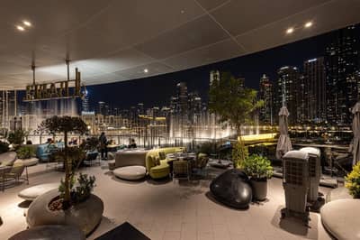 Babel Dubai Restaurant Downtown terrace with city skyline at night.