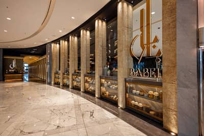 Elegant entrance of Babel Dubai Restaurant Downtown with decorative columns.