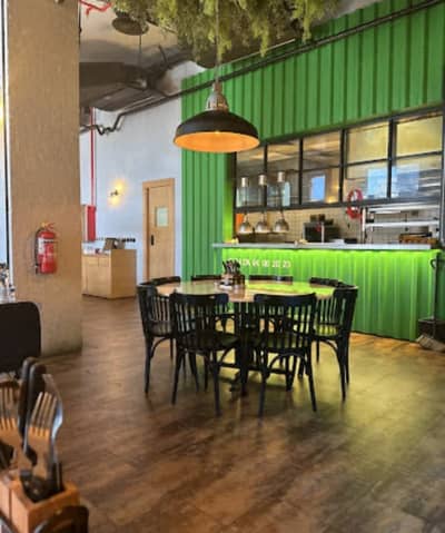 Swiss Butter Le Mall Jeddah, cozy dining area with green decor.